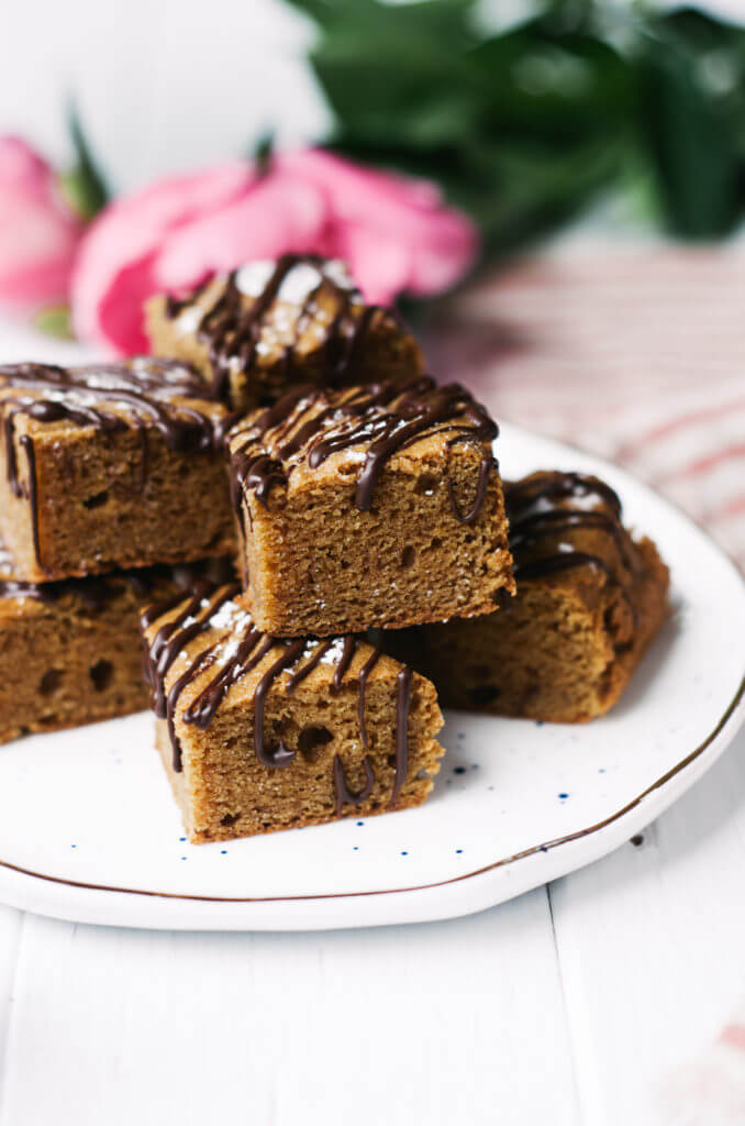 This Paleo snack cake is so incredibly moist and practically melts in your mouth. Tastefully drizzled with lushes chocolate sauce, this grain free dessert makes a perfect snack for those sweet tooth cravings.