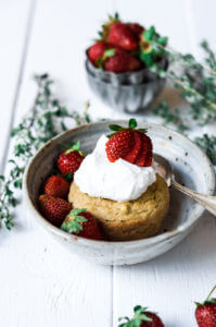 This soft grain free paleo mug muffin is made in a few minutes. Topped with lushes whipped cream and fresh strawberries, this easy to make recipe for strawberry shortcake mug muffin is a delicious time saver and makes for an easy breakfast, dessert, or snack. This recipe is sugar free and sweetened with stevia liquid.