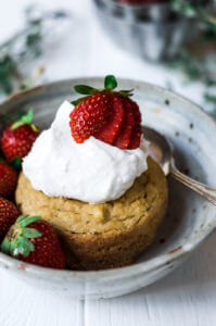 This soft grain free paleo mug muffin is made in a few minutes. Topped with lushes whipped cream and fresh strawberries, this easy to make recipe for strawberry shortcake mug muffin is a delicious time saver and makes for an easy breakfast, dessert, or snack. This recipe is sugar free and sweetened with stevia liquid.