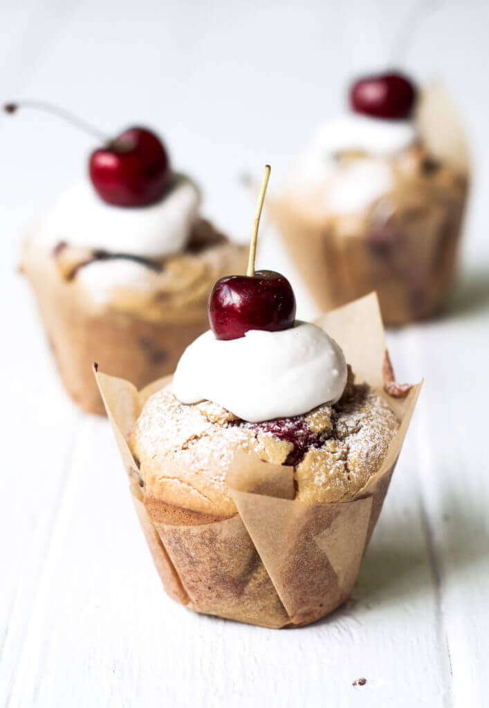 These easy breakfast muffins are soft, moist, cakey and paleo! Stuffed with fresh cherries and delicious served with fresh whipped cream. These easy to make grain free breakfast treats are an easy and healthy go-to recipe.