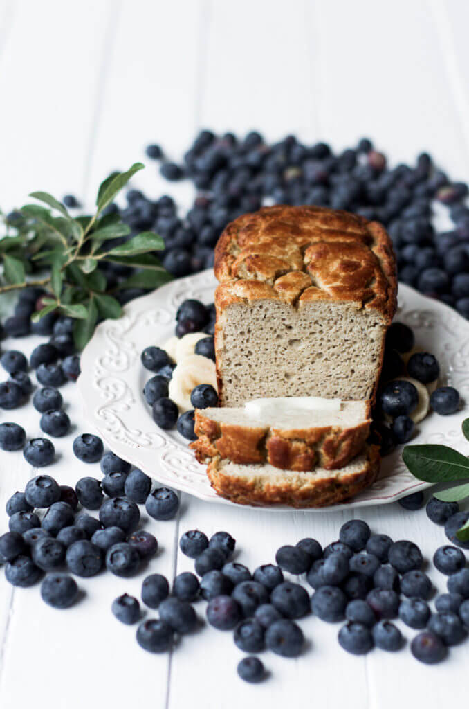 This Grain Free & Paleo Banana Bread is incredibly easy to make and it's made in a blender! Light and airy bread with a delicious crust, this banana bread only takes 5 minutes to whip up and then it's in the oven.