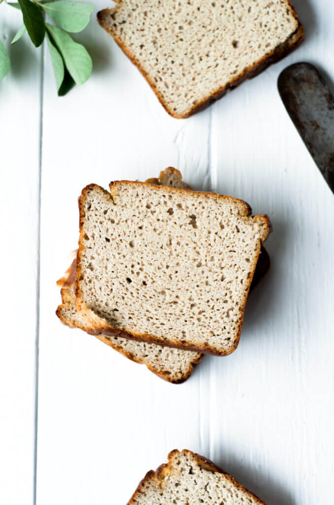 This Grain Free & Paleo Banana Bread is incredibly easy to make and it's made in a blender! Light and airy bread with a delicious crust, this banana bread only takes 5 minutes to whip up and then it's in the oven.