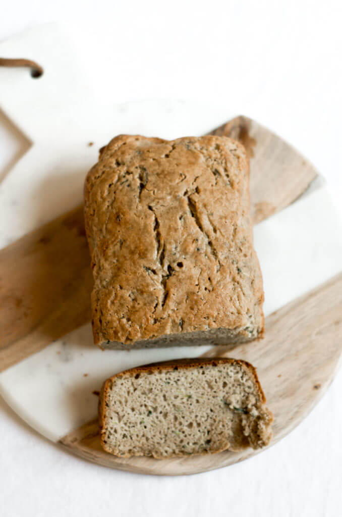 This 5 Minute Paleo Zucchini Bread is incredibly moist, light, and fluffy. Packed with protein and whole foods, this easy to make bread is a tasty treat for breakfast and any snacking occasion.