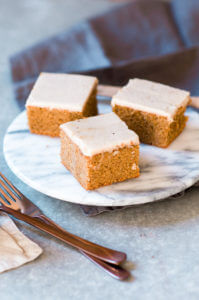 Grain free, gluten free, healthy, paleo, protein packed pumpkin cake with vegan maple frosting- no refined sugar! Soft, light, perfect for a fall dessert or healthy paleo snack. Easy Pumpkin Breakfast Cake.