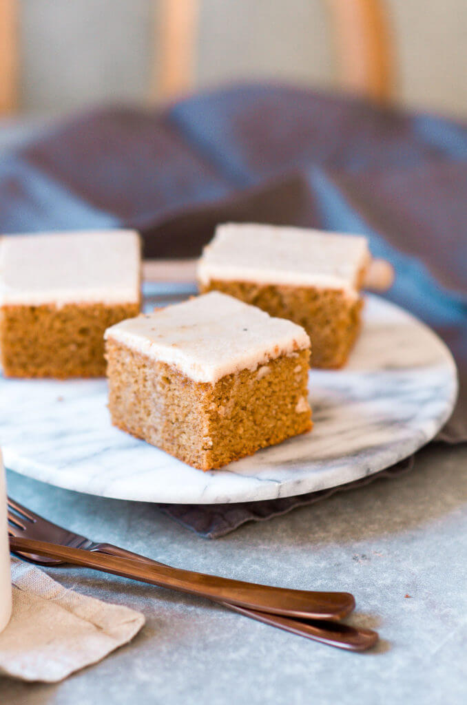 Grain free, gluten free, healthy, paleo, protein packed pumpkin cake with vegan maple frosting- no refined sugar! Soft, light, perfect for a fall dessert or healthy paleo snack. Easy Pumpkin Breakfast Cake.