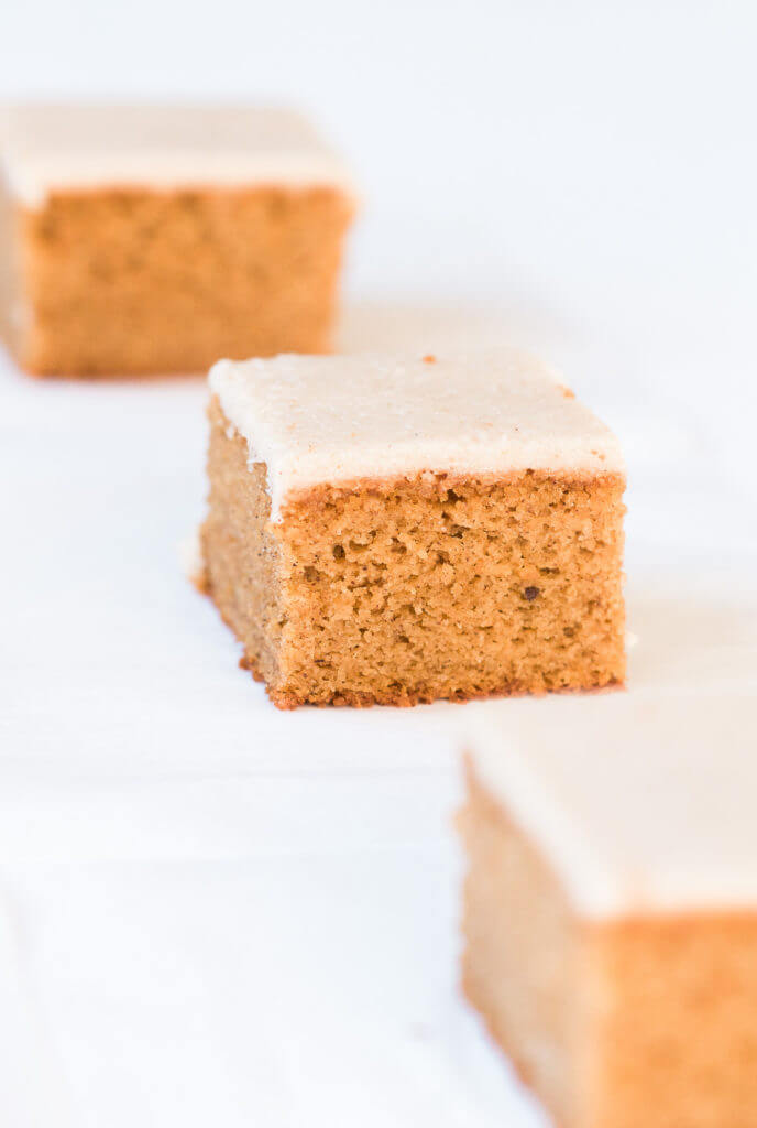 Grain free, gluten free, healthy, paleo, protein packed pumpkin cake with vegan maple frosting- no refined sugar! Soft, light, perfect for a fall dessert or healthy paleo snack. Easy Pumpkin Breakfast Cake.