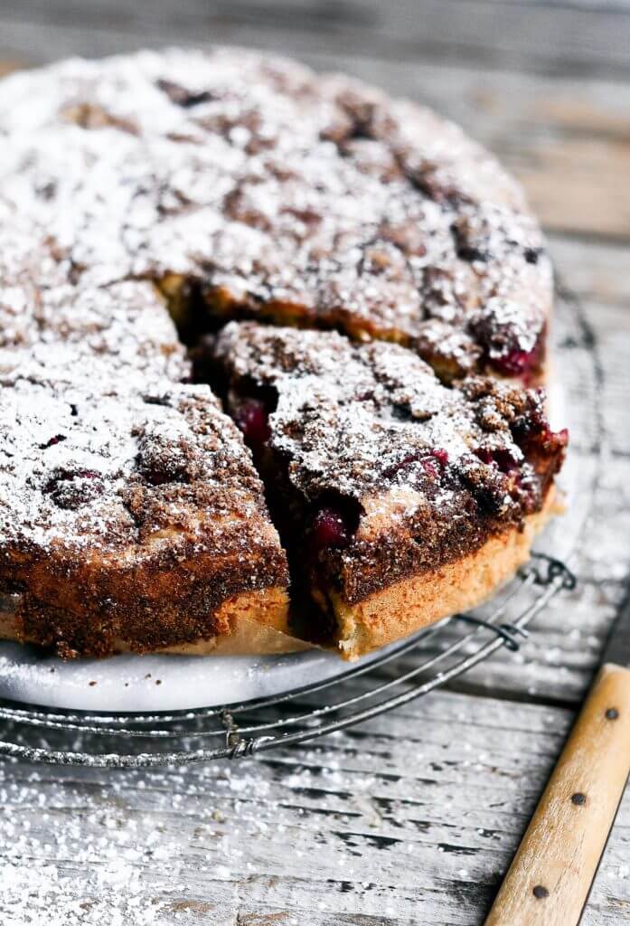 Drool worthy Healthy gluten free cranberry coffee cake. Wow your guest or make Christmas morning a stunner with this 10 minute paleo coffee cake. Healthy breakfast idea.