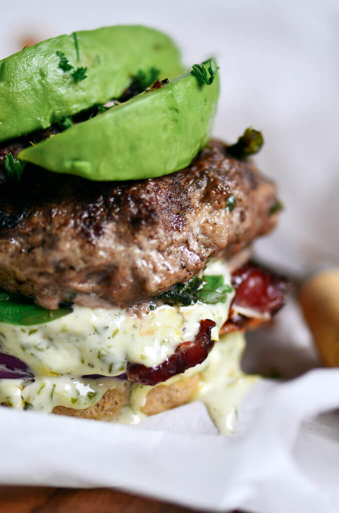The most delicious LEGIT Paleo bacon avocado burgers! Loaded with fresh basil and garlic. Topped with a creamy white sauce and red onion. Plus, these fluffy and soft grain free buns are to die for! Check out the whole30 burger option too! Paleo burger recipe. Paleo burger patties. Paleo beef burgers. Paleo meal plan. Easy paleo dinner recipes. Easy whole30 dinner recipes. Whole30 recipes. Whole30 lunch. Whole30 meal planning. Whole30 meal prep. Healthy paleo meals. Healthy Whole30 recipes. Easy Whole30 recipes.