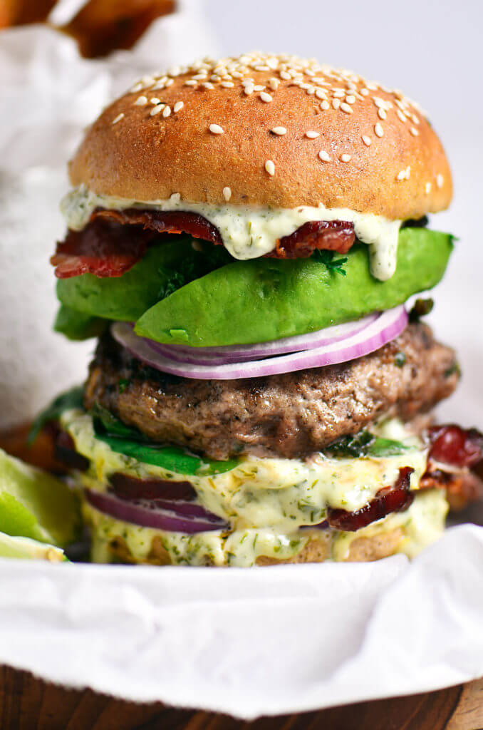 The most delicious LEGIT Paleo bacon avocado burgers! Loaded with fresh basil and garlic. Topped with a creamy white sauce and red onion. Plus, these fluffy and soft grain free buns are to die for! Check out the whole30 burger option too! Paleo burger recipe. Paleo burger patties. Paleo beef burgers. Paleo meal plan. Easy paleo dinner recipes. Easy whole30 dinner recipes. Whole30 recipes. Whole30 lunch. Whole30 meal planning. Whole30 meal prep. Healthy paleo meals. Healthy Whole30 recipes. Easy Whole30 recipes.