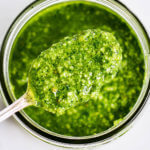 5 Minute Vegan Kale Pesto - made with pine nuts, olive oil, kale, parsley, garlic, salt, and lemon juice. So easy and extremely versatile for pizzas, salads, pasta, and breads! Less than 99 calories per serving. Easy whole30 pesto. paleo pesto recipe. Dairy free pesto. Best dairy free pesto recipe. Best whole30 pesto recipe.