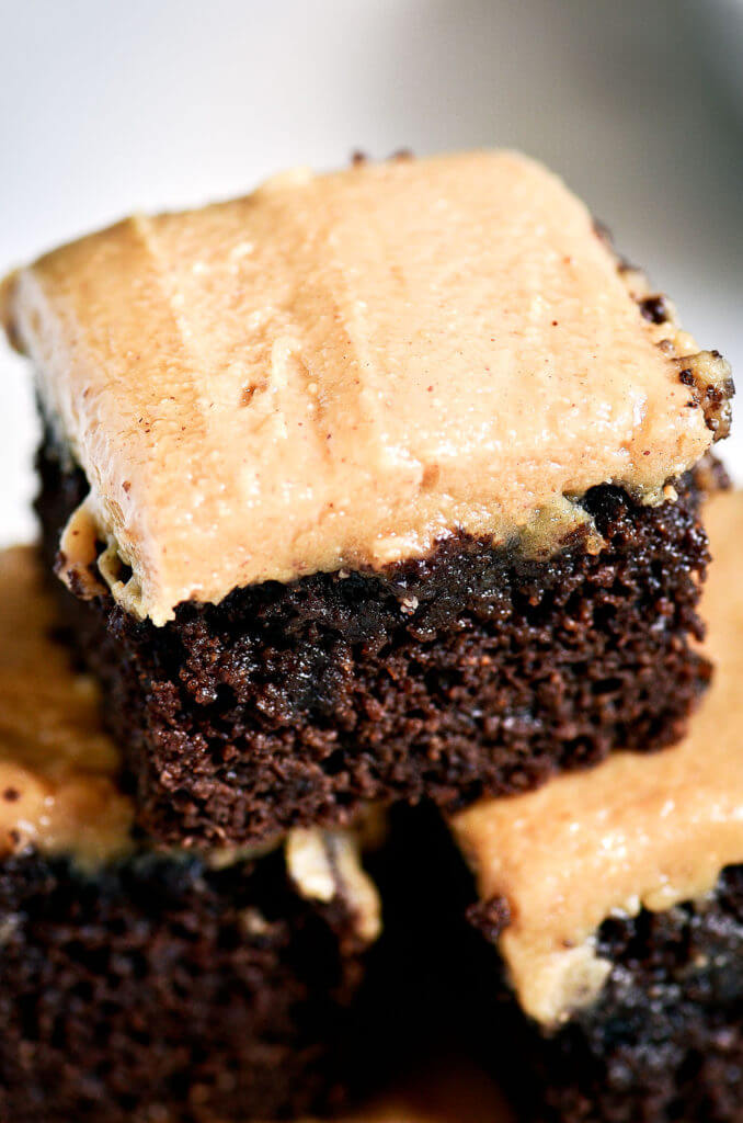 Ready for some chocolate goodness?! The best healthy paleo coconut flour brownies topped with a smooth and creamy peanut butter frosting (almond butter for paleoers). Each brownie has 16g protein! Best gluten free brownies. Best paleo brownies recipe. Fudgey paleo brownie recipe. Fudgey chocolate brownies. Healthy brownie recipe. Easy paleo brownies.