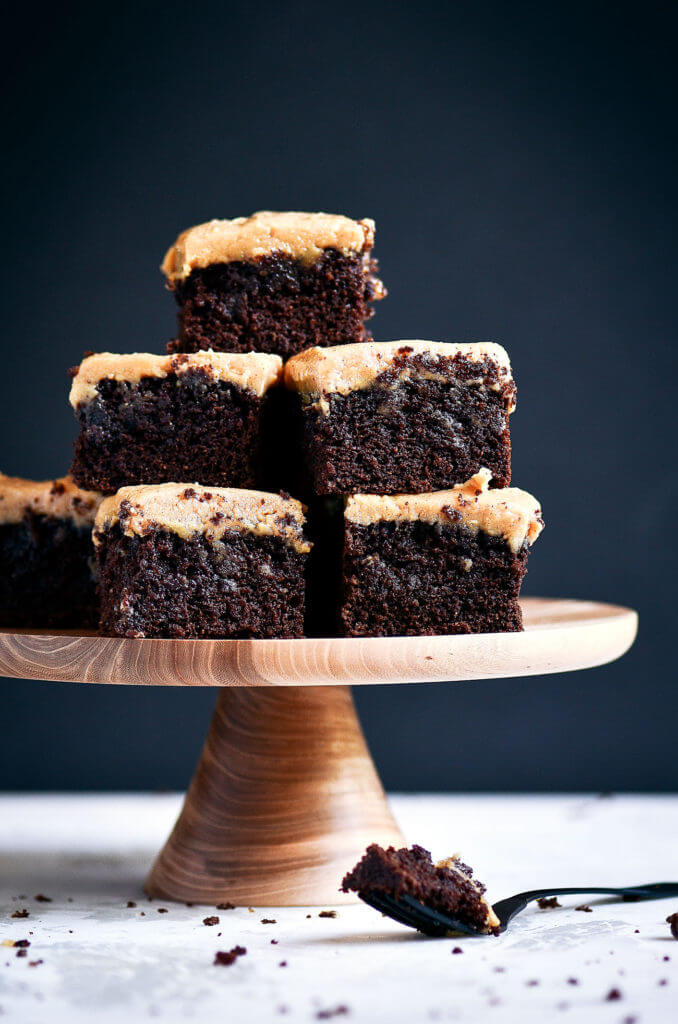 Ready for some chocolate goodness?! The best healthy paleo coconut flour brownies topped with a smooth and creamy peanut butter frosting (almond butter for paleoers). Each brownie has 16g protein! Best gluten free brownies. Best paleo brownies recipe. Fudgey paleo brownie recipe. Fudgey chocolate brownies. Healthy brownie recipe. Easy paleo brownies.