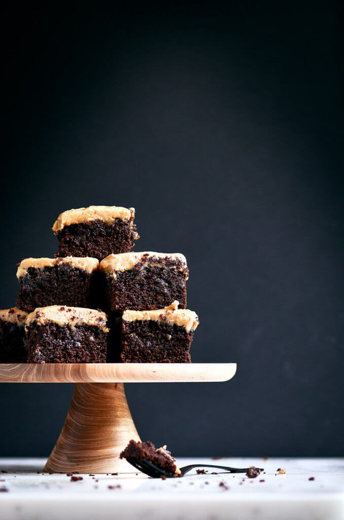 Ready for some chocolate goodness?! The best healthy paleo coconut flour brownies topped with a smooth and creamy peanut butter frosting (almond butter for paleoers). Each brownie has 16g protein! Best gluten free brownies. Best paleo brownies recipe. Fudgey paleo brownie recipe. Fudgey chocolate brownies. Healthy brownie recipe. Easy paleo brownies.