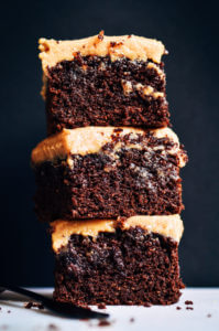 Best healthy paleo coconut flour brownies- topped with a smooth and creamy peanut butter frosting. An easy recipe that will kill the dessert round! Gluten free, paleo friendly, and ready to bake in 8 minutes! #paleo #brownies #chocolate easy paleo dessert recipes. Quick sugar free paleo dessert. healthy Chocolate paleo desserts. Gluten free cake dessert.