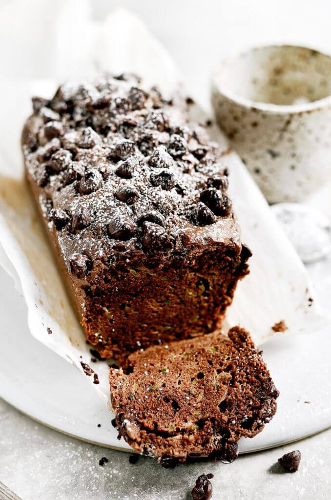 This paleo chocolate zucchini bread is soft, light, and moist, plus gluten free! It’s ready for baking in 5 minutes! Easy to whip up in the food processor. Freezer friendly and a crowd pleaser! Easy paleo diet recipes. Best gluten free bread. Easy paleo bread recipe. Best paleo zucchini bread recipe. Easy gluten free zucchini bread. Best gluten free zucchini bread.