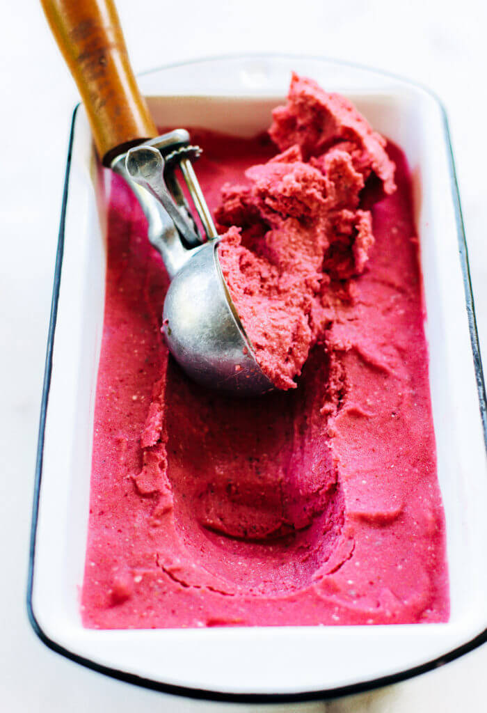 Three minute strawberry ice-cream. 43 calories per scoop! No bananas! Made instantly in a blender. No churn, no machine, no freezing. No waiting! Vegan and paleo. It’s practically lunch!