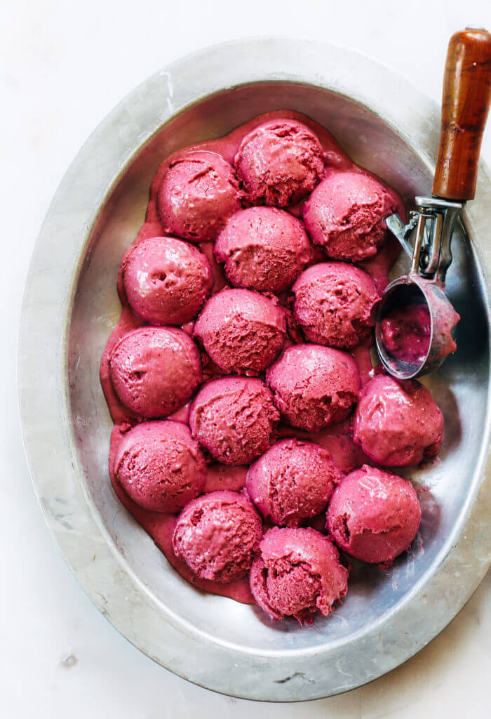 Three minute strawberry ice-cream. 43 calories per scoop! No bananas! Made instantly in a blender. No churn, no machine, no freezing. No waiting! Vegan and paleo. It’s practically lunch!