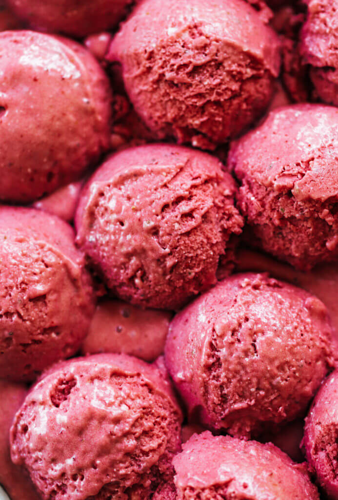 Three minute strawberry ice-cream. 43 calories per scoop! No bananas! Made instantly in a blender. No churn, no machine, no freezing. No waiting! Vegan and paleo. It’s practically lunch!