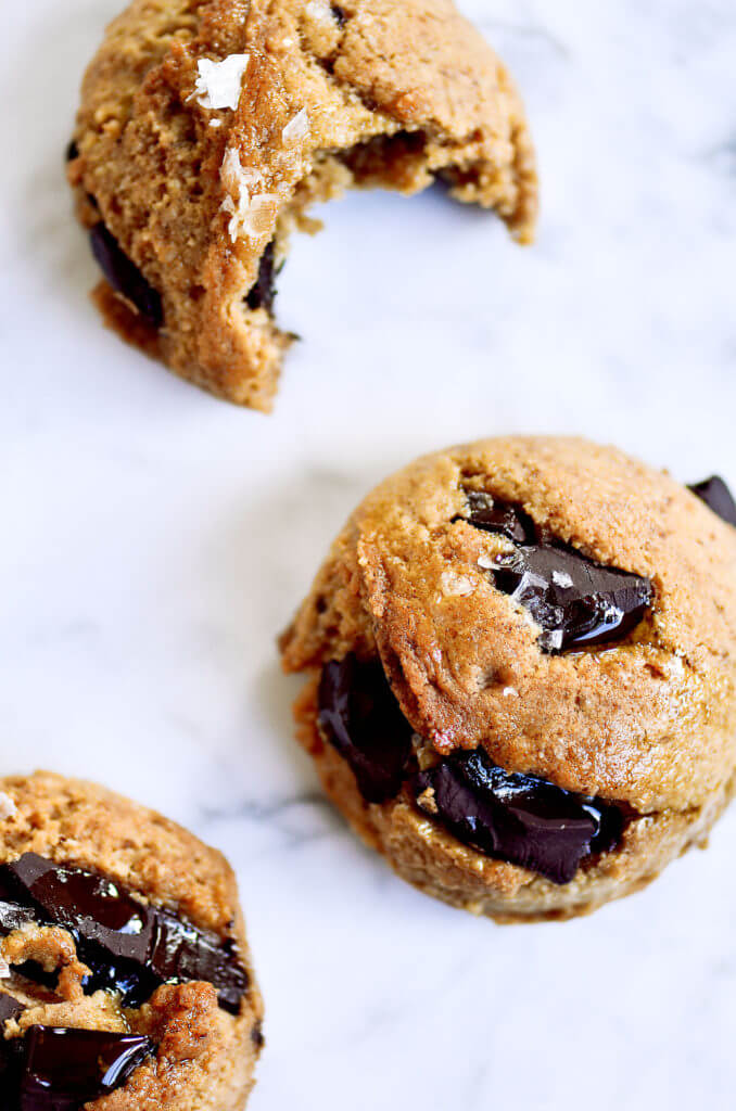Thick and chewy paleo vegan chocolate chunk cooke recipe. The most delicious paleo and vegan chocolate chunk cookies! Thick, of so soft, chewy, perfect texture. Ready for eating in only 15 minutes. My favorite Paleo cookie I’ve ever made… and I’ve made a lot! Easy paleo cookies. Paleo cookies recipe. Healthy paleo cookies. Paleo chocolate chip cookie recipe. Almond flour cookie recipe. Easy healthy cookie recipe. Best gluten free chocolate chip cookie recipe. vegan cookie recipes. Easy vegan cookies. Easy gluten free cookies. Best paleo chocolate chip cookies. Simple paleo chocolate chip cookies. Maple syrup paleo cookie recipe.