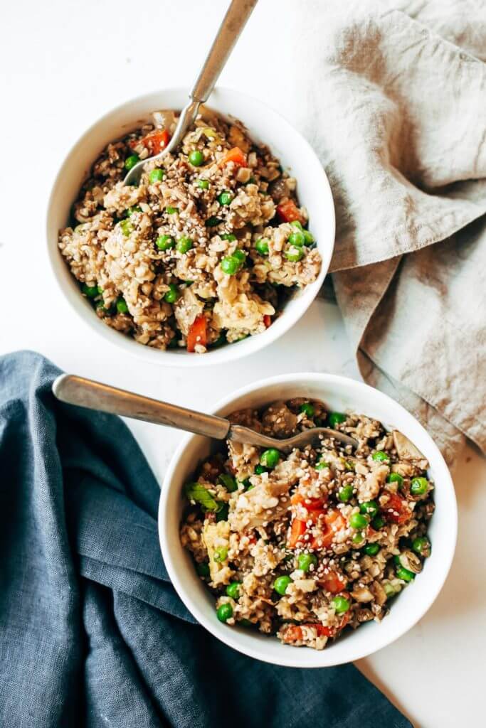 Easy 10 minute fried cauliflower rice- whole30 and paleo! Make ahead and freeze! A healthy and fun family dinner. Topped with a homemade date sweetened gooey silky smooth “soy sauce”, green onions, and sesame seeds. whole30 meal plan. Easy whole30 dinner recipes. Easy whole30 dinner recipes. Whole30 recipes. Whole30 lunch. Whole30 meal planning. Whole30 meal prep. Healthy paleo meals. Healthy Whole30 recipes. Easy Whole30 recipes. Easy whole30 dinner recipes. Best whole30 dinner recipes. Best cauliflower fried rice recipe. Easy fried rice. Best fried rice. Healthy paleo dinner recipe. Easy paleo meal ideas.