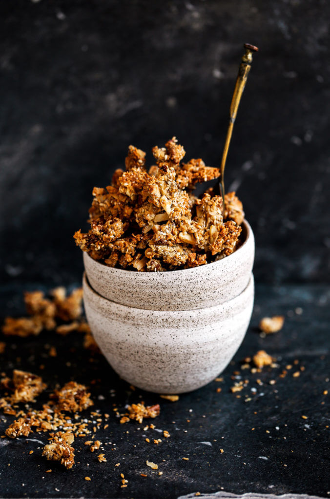 Crispy, crunchy, no oil or oats, or refined sugar! This healthy Paleo granola recipe is insanely delish and made in 30 minutes! Perfectly paired with coconut yogurt. Made with toasty coconut, almond, nutty infusions, and cinnamon spice. Sweetened naturally.! Made in minutes. Whole30 breakfast recipes. Whole30 breakfast ideas. Whole30 granola. Paleo granola recipe. Easy paleo granola. Best grain free granola recipe. Healthy breakfast ideas. Easy breakfast recipes. Whole30 meal ideas. whole30 meal plan.