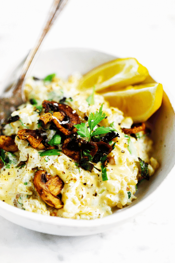 This recipe for whole30 “cheesy” risotto will leave you wanting more! Healthy whole30 and paleo creamy cauliflower risotto with truffle toasted mushrooms and a silky smooth best ever vegan cheese sauce! Only three minutes cooking time! whole30 meal plan. Easy whole30 dinner recipes. Easy whole30 dinner recipes. Whole30 recipes. Whole30 lunch. Whole30 meal planning. Whole30 meal prep. Healthy paleo meals. Healthy Whole30 recipes. Easy Whole30 recipes. Easy whole30 dinner recipes. Best whole30 dinner recipes. Best cauliflower fried rice recipe. Easy cauliflower rice. Best cauliflower rice. Healthy paleo dinner recipe. Easy paleo meal ideas.