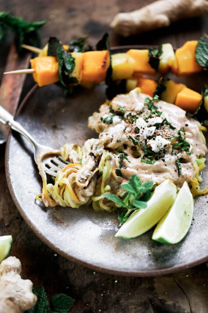 Low carb whole30 sesame ginger zucchini noodles with grilled pineapple, mango, and mint! Fresh, healthy, and low calorie dinner recipe loaded with healthy fats and my new favorite creamy sesame ginger sauce.whole30 meal plan. Easy whole30 dinner recipes. Easy whole30 dinner recipes. Whole30 recipes. Whole30 lunch. Whole30 meal planning. Whole30 meal prep. Healthy paleo meals. Healthy Whole30 recipes. Easy Whole30 recipes. Easy whole30 dinner recipes. Zucchini noodle recipe. Best veggie noodle recipes. paleo dinner recipes. best asian noodles. easy asian noodles.