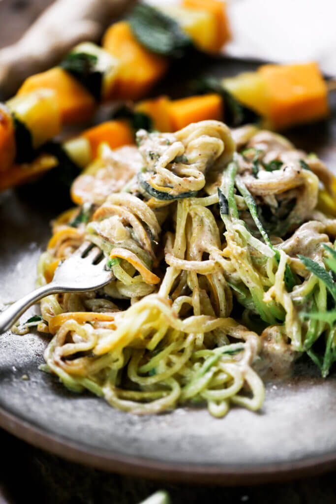 Low carb whole30 sesame ginger zucchini noodles with grilled pineapple, mango, and mint! Fresh, healthy, and low calorie dinner recipe loaded with healthy fats and my new favorite creamy sesame ginger sauce.whole30 meal plan. Easy whole30 dinner recipes. Easy whole30 dinner recipes. Whole30 recipes. Whole30 lunch. Whole30 meal planning. Whole30 meal prep. Healthy paleo meals. Healthy Whole30 recipes. Easy Whole30 recipes. Easy whole30 dinner recipes. Zucchini noodle recipe. Best veggie noodle recipes. paleo dinner recipes. best asian noodles. easy asian noodles.