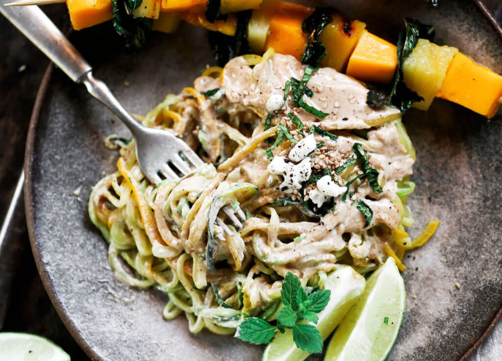 Low carb whole30 sesame ginger zucchini noodles with grilled pineapple, mango, and mint! Fresh, healthy, and low calorie dinner recipe loaded with healthy fats and my new favorite creamy sesame ginger sauce.whole30 meal plan. Easy whole30 dinner recipes. Easy whole30 dinner recipes. Whole30 recipes. Whole30 lunch. Whole30 meal planning. Whole30 meal prep. Healthy paleo meals. Healthy Whole30 recipes. Easy Whole30 recipes. Easy whole30 dinner recipes. Zucchini noodle recipe. Best veggie noodle recipes. paleo dinner recipes. best asian noodles. easy asian noodles.