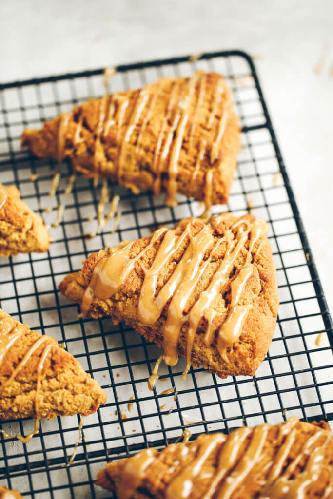 Easy gluten free, paleo pumpkin spice scones with maple glaze. A warm and comforting grain free treat for cosy fall mornings. This grain free pumpkin scone recipe is a family favorite. If you love scones as much as I do, then today is gonna be a good day for you! Easy gluten free scones Gluten free pumpkin scones. Paleo pumpkin scones. Paleo vegan pumpkin scones. Easy paleo pumpkin scones. Starbucks copy cat pumpkin scones. Healthy gluten free scones.