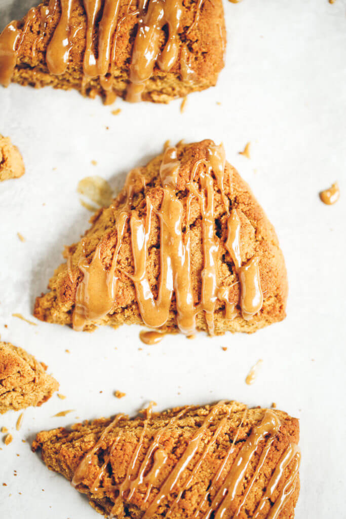 Easy gluten free, paleo pumpkin spice scones with maple glaze. A warm and comforting grain free treat for cosy fall mornings. This grain free pumpkin scone recipe is a family favorite. If you love scones as much as I do, then today is gonna be a good day for you! Easy gluten free scones Gluten free pumpkin scones. Paleo pumpkin scones. Paleo vegan pumpkin scones. Easy paleo pumpkin scones. Starbucks copy cat pumpkin scones. Healthy gluten free scones.