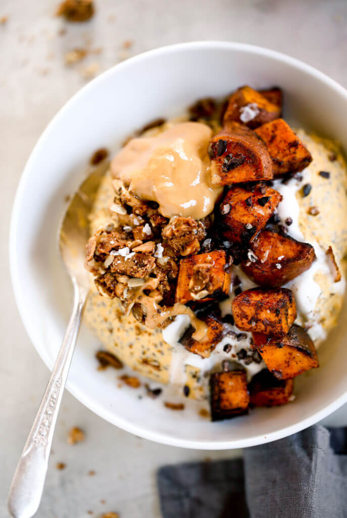 I’m OBSESSED with this thick, creamy, coconut yogurt pumpkin chia breakfast! What an easy paleo breakfast idea! A bowl full of creamy pumpkin spice pudding, topped with roasted sweet potatoes and nut butter! Ready in just 3 minutes, free of added sugar, Paleo, dairy free, and gluten free. Just as delicious for a snack as it is for breakfast!