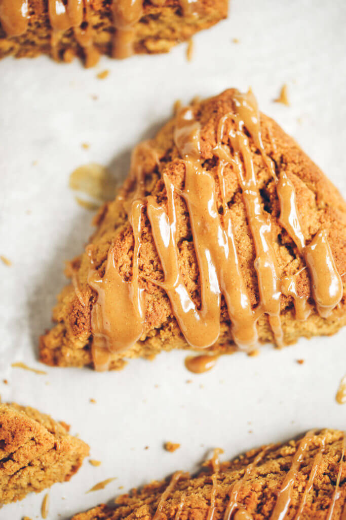 Easy gluten free, paleo pumpkin spice scones with maple glaze. A warm and comforting grain free treat for cosy fall mornings. This grain free pumpkin scone recipe is a family favorite. If you love scones as much as I do, then today is gonna be a good day for you! Easy gluten free scones Gluten free pumpkin scones. Paleo pumpkin scones. Paleo vegan pumpkin scones. Easy paleo pumpkin scones. Starbucks copy cat pumpkin scones. Healthy gluten free scones.