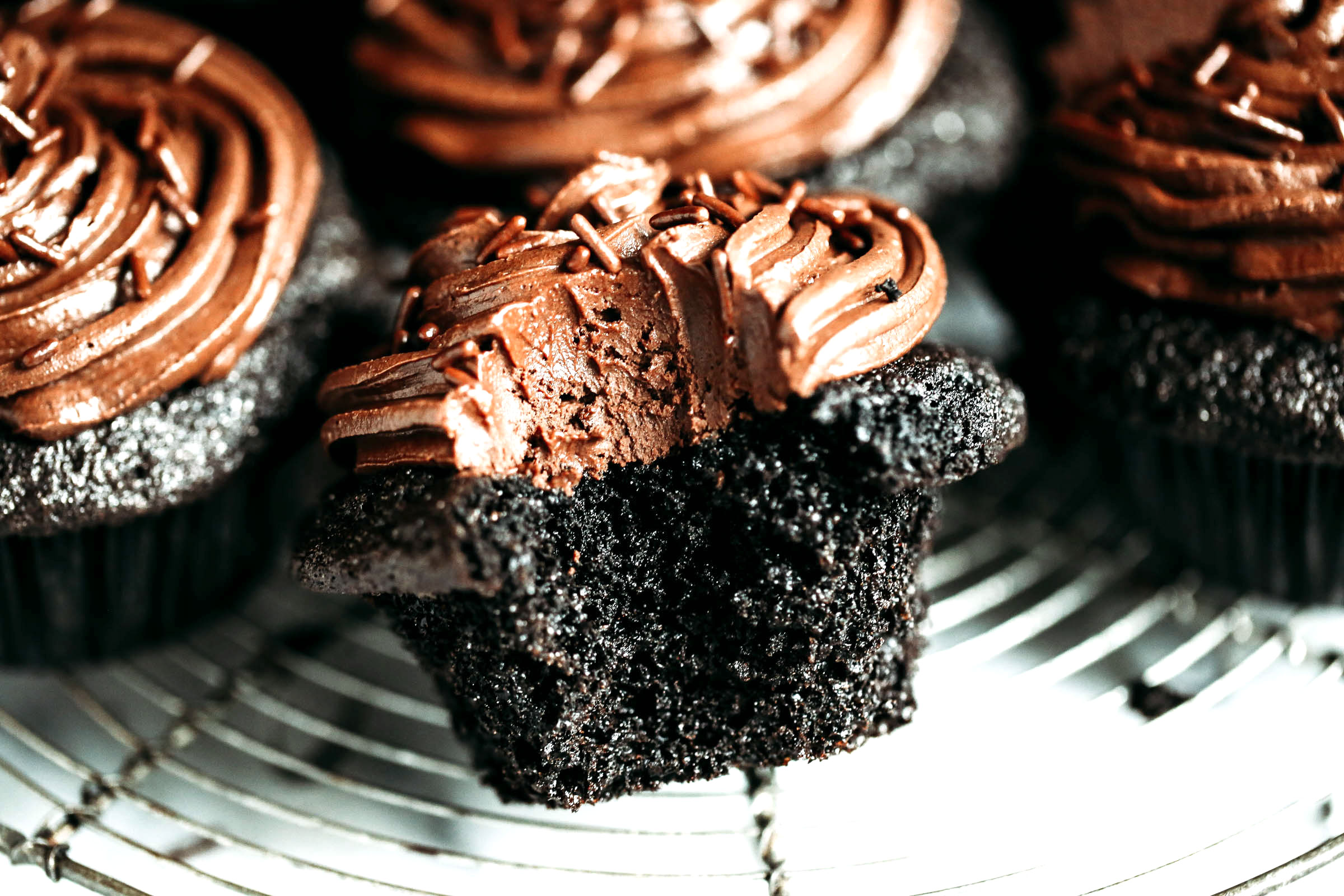 Paleo chocolate cupcakes-moist, but not eggy! These paleo cupcakes have a rich, dark chocolate taste and are covered in a whipped dairy free refined sugar free chocolate frosting! Coconut flour cupcakes. Best easy Paleo cupcakes. Paleo cupcakes recipes. Gluten free chocolate cupcakes. Gluten free coconut flour cupcakes. Dairy free healthy cupcakes. Paleo chocolate frosting.