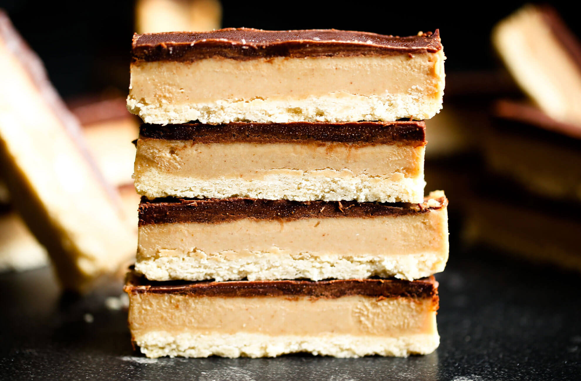Make these healthy paleo Twix bars at home! You won’t be able to tell the difference between these copycat candy bars and the popular original. Game changer: this recipe for healthy homemade paleo Twix candy bars. They are paleo, gluten free, sugar free, and vegan. Healthy homemade Twix bar recipe. Homemade paleo Twix candy bars. Homemade Twix bars. Healthy candy recipe. Homemade paleo candy. Homemade paleo chocolate candy. Easy paleo wit bars. Easy best homemade Twix bars.