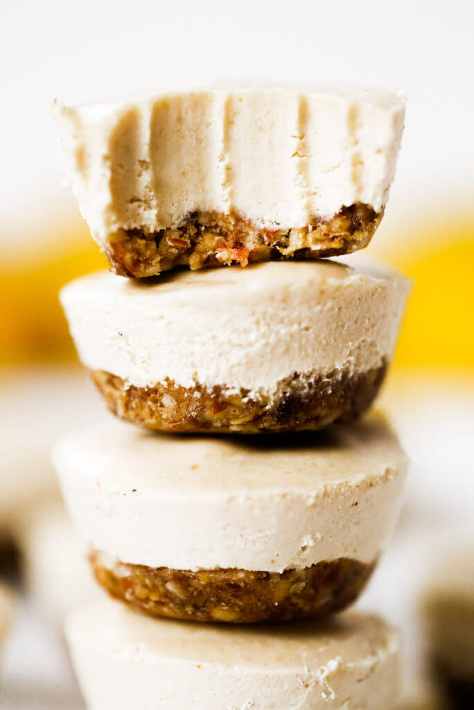 No-bake lemon cheesecake bites made in the blender! (Paleo + vegan). Thick creamy cashew cheesecake lemon layer with nut and date crust. Bite-size made quickly in a blender or food processor- chilled before eating! Gluten free, dairy free, refined sugar free. Easy no bake cheesecake recipes. NO Bake cheesecake Filling. Easy vegan cheesecake recipes. Best vegan cheesecake. Easy paleo cheesecake recipes. Dairy free paleo cheesecake. Best raw cheesecake recipes. Easy raw cheesecake.