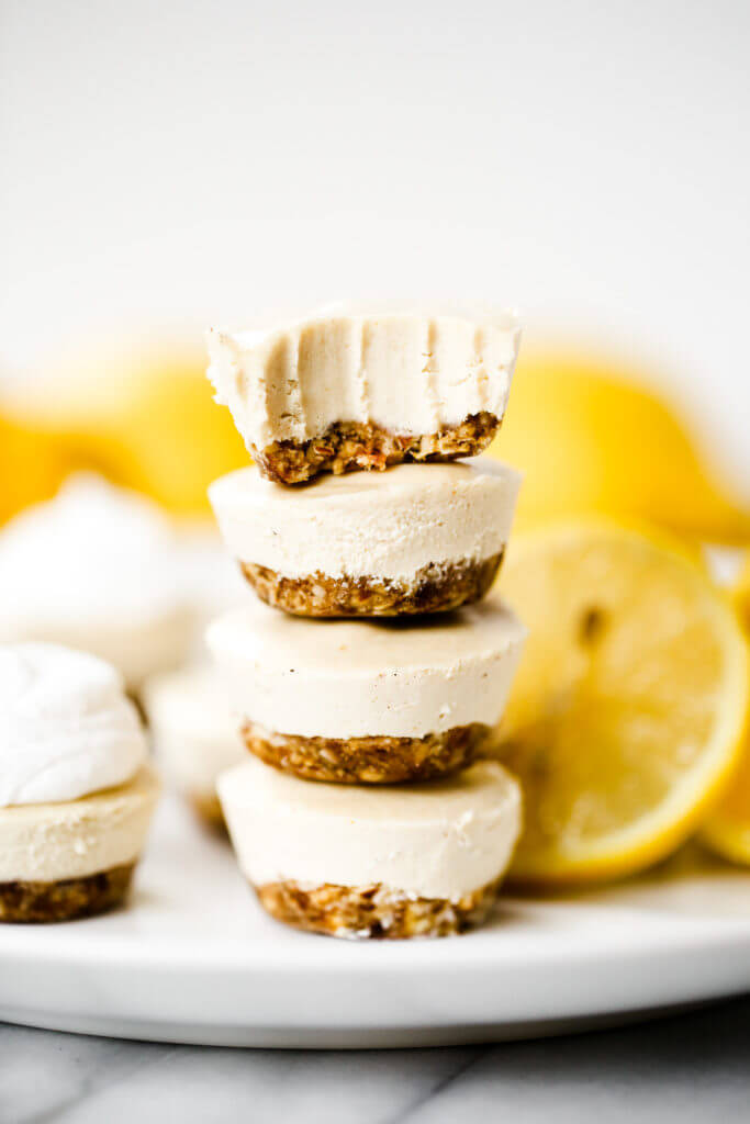 No-bake lemon cheesecake bites made in the blender! (Paleo + vegan). Thick creamy cashew cheesecake lemon layer with nut and date crust. Bite-size made quickly in a blender or food processor- chilled before eating! Gluten free, dairy free, refined sugar free. Easy no bake cheesecake recipes. NO Bake cheesecake Filling. Easy vegan cheesecake recipes. Best vegan cheesecake. Easy paleo cheesecake recipes. Dairy free paleo cheesecake. Best raw cheesecake recipes. Easy raw cheesecake.