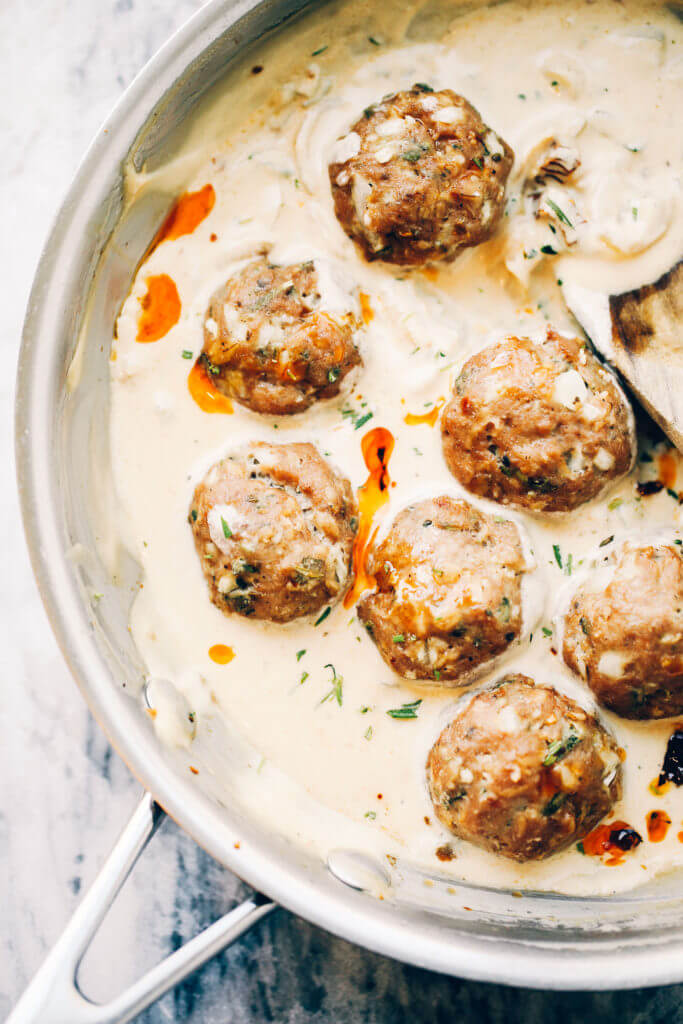 Unbelievably easy Oven Baked Paleo TURKEY MEATBALLS AND SAGE CREAM SAUCE (Gluten free, whole30, paleo). Perfect for a weeknight dinner or breakfast! On the table in LESS than 25 minutes! Paleo turkey meatballs. Whole30 breakfast recipes. Easy whole30 breakfast ideas. Whole30 families meatballs. Ground turkey whole30 meatballs. Easy whole30 recipes. Whole30 meal planning. Easy whole30 dinner recipes. Whole30 shopping list.