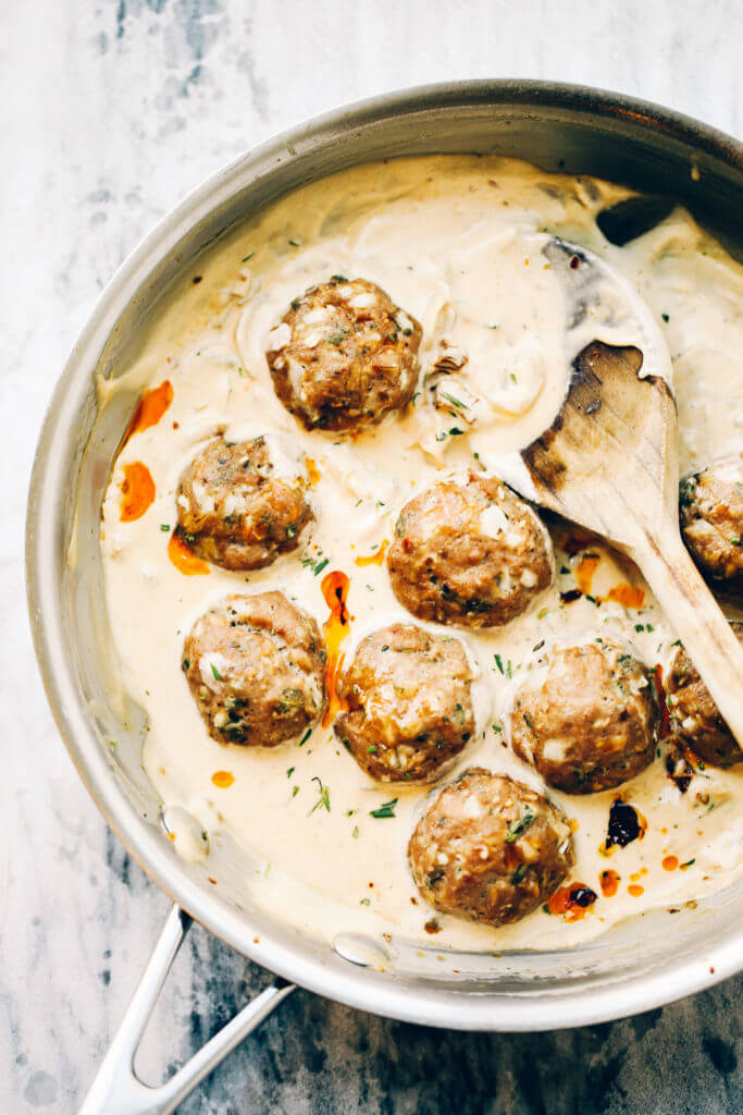 Unbelievably easy Oven Baked Paleo TURKEY MEATBALLS AND SAGE CREAM SAUCE (Gluten free, whole30, paleo). Perfect for a weeknight dinner or breakfast! On the table in LESS than 25 minutes! Paleo turkey meatballs. Whole30 breakfast recipes. Easy whole30 breakfast ideas. Whole30 families meatballs. Ground turkey whole30 meatballs. Easy whole30 recipes. Whole30 meal planning. Easy whole30 dinner recipes. Whole30 shopping list.