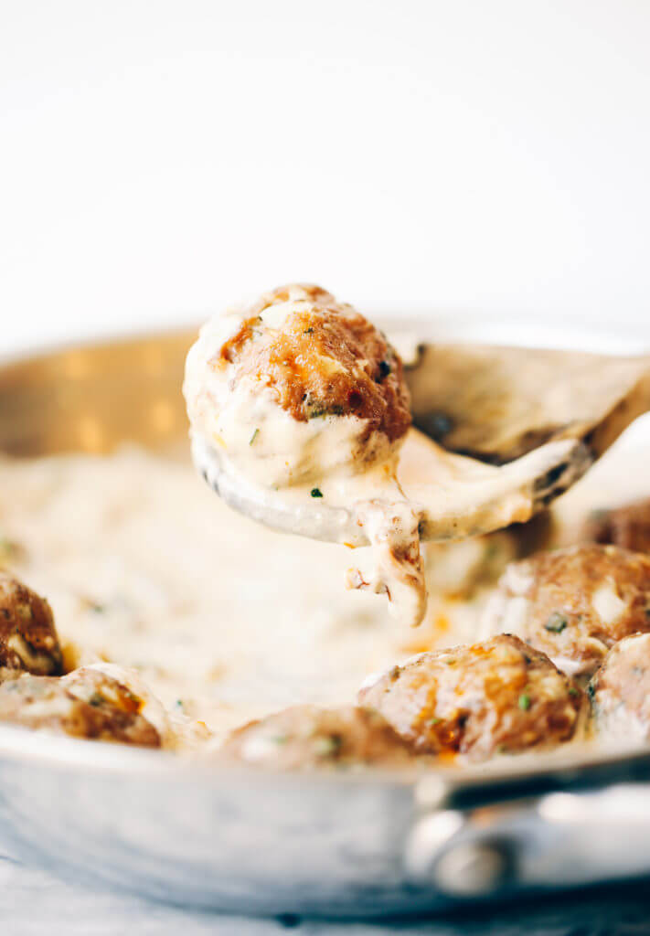 Unbelievably easy Oven Baked Paleo TURKEY MEATBALLS AND SAGE CREAM SAUCE (Gluten free, whole30, paleo). Perfect for a weeknight dinner or breakfast! On the table in LESS than 25 minutes! Paleo turkey meatballs. Whole30 breakfast recipes. Easy whole30 breakfast ideas. Whole30 families meatballs. Ground turkey whole30 meatballs. Easy whole30 recipes. Whole30 meal planning. Easy whole30 dinner recipes. Whole30 shopping list.