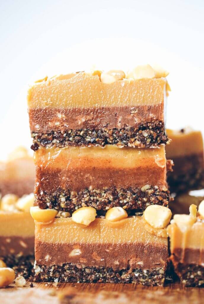 Three layers of coconut oil caramel fudge- refined sugar free, raw, paleo. Layered with tahini + almond butter fudge! Paleo candy recipes. Paleo candy bar. SO easy to make! Tastes like Christmas candy, but it’s sugar free, paleo, and raw! Paleo candy pecans. Low carb candy. Healthy candy recipes. Paleo caramel. Easy healthy paleo caramel. Paleo fudge. Easy almond butter fudge. Tahini fudge. Healthy dairy free fudge recipes. Coconut oil fudge.