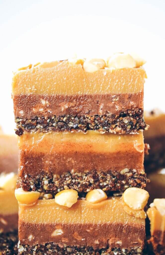 Three layers of coconut oil caramel fudge- refined sugar free, raw, paleo. Layered with tahini + almond butter fudge! Paleo candy recipes. Paleo candy bar. SO easy to make! Tastes like Christmas candy, but it’s sugar free, paleo, and raw! Paleo candy pecans. Low carb candy. Healthy candy recipes. Paleo caramel. Easy healthy paleo caramel. Paleo fudge. Easy almond butter fudge. Tahini fudge. Healthy dairy free fudge recipes. Coconut oil fudge.