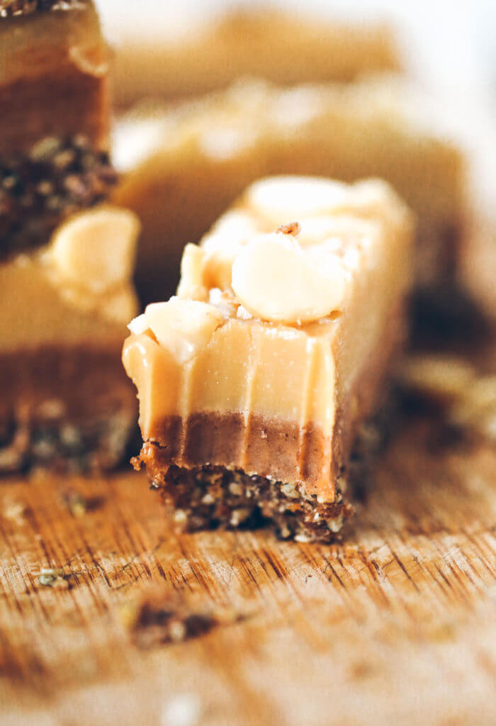 Three layers of coconut oil caramel fudge- refined sugar free, raw, paleo. Layered with tahini + almond butter fudge! Paleo candy recipes. Paleo candy bar. SO easy to make! Tastes like Christmas candy, but it’s sugar free, paleo, and raw! Paleo candy pecans. Low carb candy. Healthy candy recipes. Paleo caramel. Easy healthy paleo caramel. Paleo fudge. Easy almond butter fudge. Tahini fudge. Healthy dairy free fudge recipes. Coconut oil fudge.