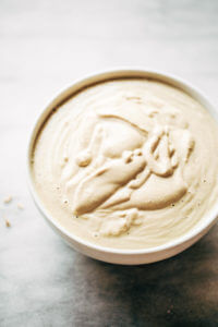 Creamy 5 minute vegan cashew cheese sauce! Whole30, paleo, and dairy free. Whipped smooth, made with raw cashews, and tastes like the perfect cheese dip for vegetables, chips, served over noodles, or licked straight off the spoon! Dairy free cheese. Dairy free Alfredo. Easy Cashew cheese. Homemade cashew cheese. easy vegan paleo cheese recipe. Best Dairy free cashew cheese recipe.