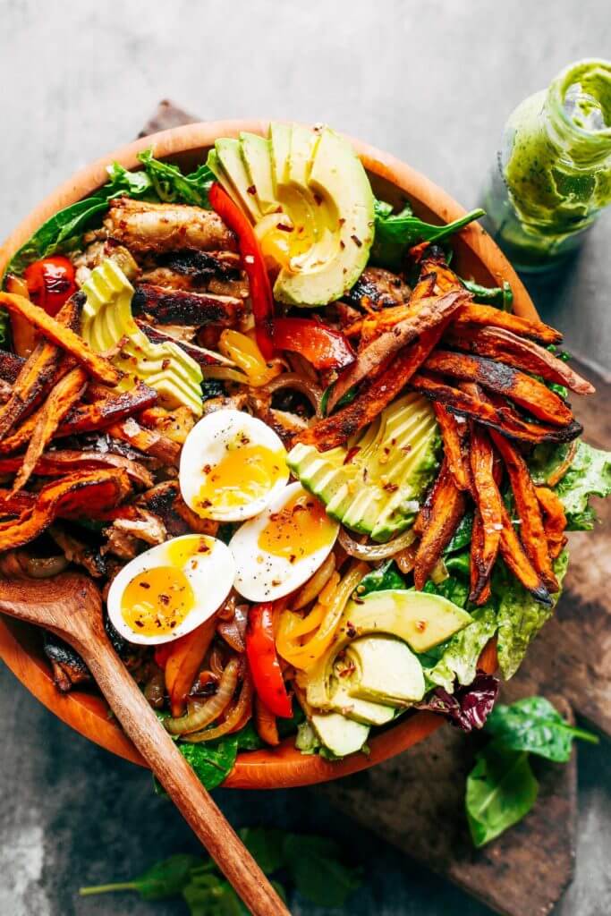 Grilled Garlic Lime Chicken Fajita Salad loaded with crispy sweet potato fries, grilled chicken, and topped with creamy avocado dressing made in the blender! Paleo, whole30, and makes for easy meal prep! Whole30 meal plan that's quick and healthy! Whole30 recipes just for you. Whole30 meal planning. Whole30 meal prep. Healthy paleo meals. Healthy Whole30 recipes. Easy Whole30 recipes. Best paleo dinner recipes.