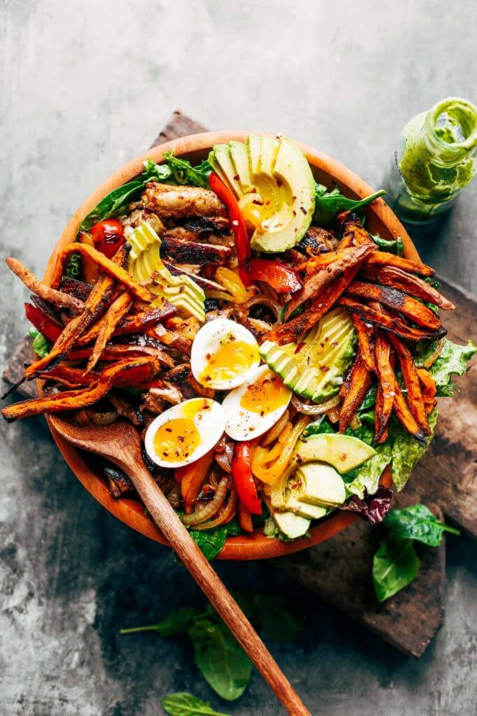 Grilled Garlic Lime Chicken Fajita Salad loaded with crispy sweet potato fries, grilled chicken, and topped with creamy avocado dressing made in the blender! Paleo, whole30, and makes for easy meal prep! Whole30 meal plan that's quick and healthy! Whole30 recipes just for you. Whole30 meal planning. Whole30 meal prep. Healthy paleo meals. Healthy Whole30 recipes. Easy Whole30 recipes. Best paleo dinner recipes.