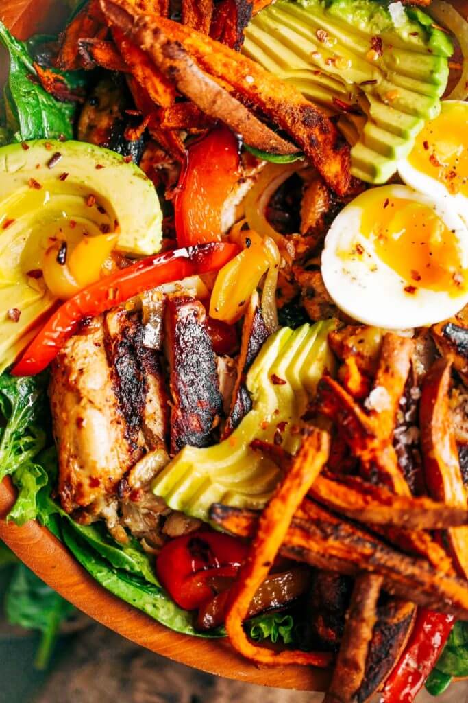 Grilled Garlic Lime Chicken Fajita Salad loaded with crispy sweet potato fries, grilled chicken, and topped with creamy avocado dressing made in the blender! Paleo, whole30, and makes for easy meal prep! Whole30 meal plan that's quick and healthy! Whole30 recipes just for you. Whole30 meal planning. Whole30 meal prep. Healthy paleo meals. Healthy Whole30 recipes. Easy Whole30 recipes. Best paleo dinner recipes.