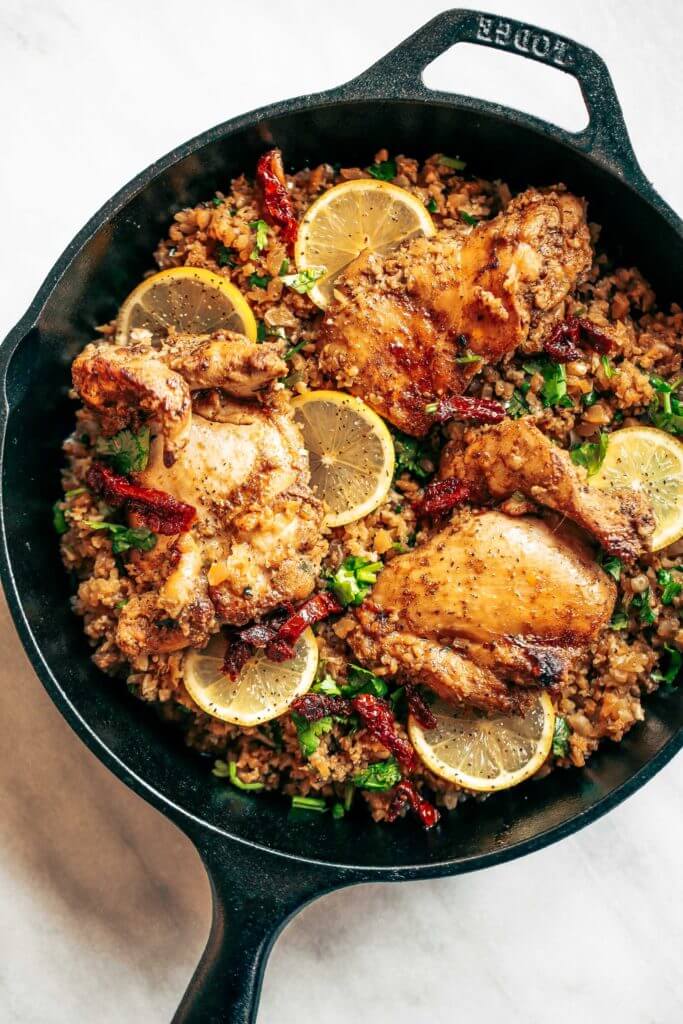 One pan Spanish cauliflower rice made in 25 minutes! Bursting with flavor! Paleo and whole30 friendly. Made with lemon, cilantro, chicken, and cauliflower rice. This one-pan skillet recipe makes for fast and easy meal prep that tastes delicious! whole30 meal plan. Easy whole30 dinner recipes. Easy whole30 dinner recipes. Whole30 recipes. Whole30 lunch. Whole30 meal planning. Whole30 meal prep. Healthy paleo meals. Healthy Whole30 recipes. Easy Whole30 recipes. Easy whole30 dinner recipes.