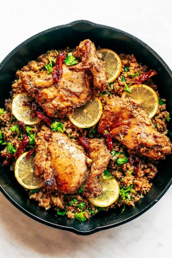One pan Spanish cauliflower rice made in 25 minutes! Bursting with flavor! Paleo and whole30 friendly. Made with lemon, cilantro, chicken, and cauliflower rice. This one-pan skillet recipe makes for fast and easy meal prep that tastes delicious! whole30 meal plan. Easy whole30 dinner recipes. Easy whole30 dinner recipes. Whole30 recipes. Whole30 lunch. Whole30 meal planning. Whole30 meal prep. Healthy paleo meals. Healthy Whole30 recipes. Easy Whole30 recipes. Easy whole30 dinner recipes.