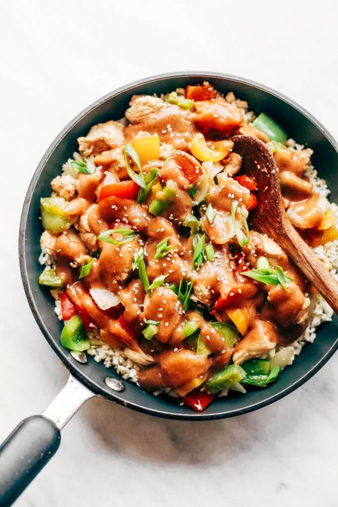 Healthy sweet and sour chicken with cauliflower rice. Paleo, whole30, and made without sugar! An easy weeknight dinner recipe, freezer friendly, and makes for fast meal prep! Whole30 meal plan that's quick and healthy! Whole30 recipes just for you. Whole30 meal planning. Whole30 meal prep. Healthy paleo meals. Healthy Whole30 recipes. Easy Whole30 recipes. Best paleo dinner recipes.